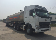 De HOWO A7 de la livraison camion d'essence et d'huile semi avec la remorque 60000 litres 65000 kilogrammes